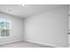 Simple bedroom featuring a window providing natural light and neutral paint tones at 573 Yellow Leaf Ln, Summerville, SC 29486