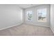 Neutral bedroom featuring two windows providing plenty of natural light and plush carpeting at 573 Yellow Leaf Ln, Summerville, SC 29486