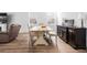Inviting dining area with a modern table, bench seating, and elegant dark wood accents at 573 Yellow Leaf Ln, Summerville, SC 29486