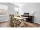 Cozy dining room with a farmhouse-style table, accent cabinet, and welcoming decor at 573 Yellow Leaf Ln, Summerville, SC 29486