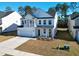 Lovely two-story home featuring a balcony, ample parking, and attractive yard at 573 Yellow Leaf Ln, Summerville, SC 29486