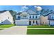Charming two-story home with a well-manicured lawn and inviting curb appeal at 573 Yellow Leaf Ln, Summerville, SC 29486