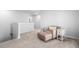 Loft area featuring comfortable chair, ottoman and side table on neutral carpet at 573 Yellow Leaf Ln, Summerville, SC 29486