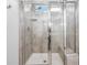 Modern glass enclosed shower featuring a shower bench and tile surround at 573 Yellow Leaf Ln, Summerville, SC 29486