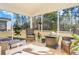Sunroom featuring outdoor furniture, potted plants, and a view of the wooded yard at 573 Yellow Leaf Ln, Summerville, SC 29486