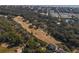 Stunning aerial view of golf course community homes with lush green landscaping and ocean view at 601 Magnolia Ln, Edisto Island, SC 29438