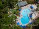 Aerial view featuring a community pool, mini-golf, and Waters Edge Cafe at 601 Magnolia Ln, Edisto Island, SC 29438
