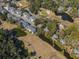 Aerial view showcasing a well-maintained golf course integrated within a residential community at 601 Magnolia Ln, Edisto Island, SC 29438