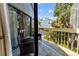 Charming balcony with seating area overlooking lush greenery, offering a relaxing outdoor space at 601 Magnolia Ln, Edisto Island, SC 29438