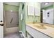Well-lit bathroom featuring a shower and tub combo and a single sink vanity with ample counter space at 601 Magnolia Ln, Edisto Island, SC 29438