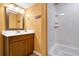 This bathroom features a single sink vanity with a mirror and a shower-tub combo at 601 Magnolia Ln, Edisto Island, SC 29438