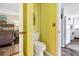 Compact bathroom with bright walls, a functional toilet, and access to the bedroom and kitchen at 601 Magnolia Ln, Edisto Island, SC 29438