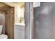 Cozy bathroom with vanity and shower featuring rustic wood walls, for a relaxed vibe at 601 Magnolia Ln, Edisto Island, SC 29438