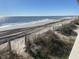 Expansive beach view with tire tracks in the sand at 601 Magnolia Ln, Edisto Island, SC 29438