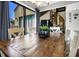Bright dining area with a wooden table, views of an outdoor balcony, and a unique spiral staircase at 601 Magnolia Ln, Edisto Island, SC 29438