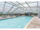 Beautiful indoor pool area with comfortable lounge chairs and a clear view of the outdoors at 601 Magnolia Ln, Edisto Island, SC 29438