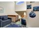 Inviting landing area with staircase and beach-themed decor, creating a warm welcome to the home at 601 Magnolia Ln, Edisto Island, SC 29438