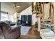 Cozy living room with vaulted ceiling, unique spiral staircase, and comfortable seating area at 601 Magnolia Ln, Edisto Island, SC 29438