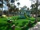 Fun-filled community playground with vibrant green turf, climbing structures, and a twisty slide at 601 Magnolia Ln, Edisto Island, SC 29438