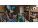 Cluttered storage area filled with various household and recreational items on shelves at 601 Magnolia Ln, Edisto Island, SC 29438
