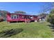 Exterior of home featuring a large backyard with an expansive wooden deck perfect for entertaining at 680 Kent St, Mount Pleasant, SC 29464