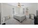 Bright bedroom featuring a ceiling fan, neutral walls, and two windows for lots of natural light at 680 Kent St, Mount Pleasant, SC 29464