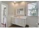 Bathroom featuring shiplap walls, a large vanity, and a window for natural light at 757 King St, Charleston, SC 29403