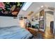 Cozy bedroom with a sloped ceiling, a skylight, and eclectic decor at 757 King St, Charleston, SC 29403