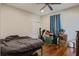 Bedroom with hardwood floors and ceiling fan at 757 King St, Charleston, SC 29403