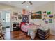 Bright bedroom featuring hardwood floors and ample closet space with unique decor and natural light at 757 King St, Charleston, SC 29403