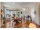 Dining area with hardwood floors, adjacent to kitchen with breakfast bar and stainless appliances at 757 King St, Charleston, SC 29403