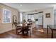 Open concept dining room and kitchen with hardwood floors and lots of light at 757 King St, Charleston, SC 29403