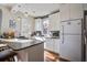 Bright kitchen with white cabinets and stainless steel appliances at 757 King St, Charleston, SC 29403