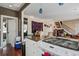 Kitchen with white cabinets, stainless steel appliances, granite countertops, and an open floorplan at 757 King St, Charleston, SC 29403