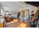 Spacious living room featuring hardwood floors, a comfortable sofa, and a well-equipped kitchen at 757 King St, Charleston, SC 29403