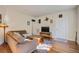 Inviting living room featuring hardwood floors, a comfortable sofa, and modern decor at 757 King St, Charleston, SC 29403