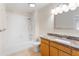 Bright bathroom features a shower-tub combo with tile surround, granite counters, and vanity at 777 Lake Frances Dr, Charleston, SC 29412