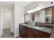 Bathroom with double sink vanity, granite countertop, and tile flooring at 777 Lake Frances Dr, Charleston, SC 29412