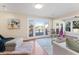 Bright living room with large windows overlooking waterfront view, creating a serene ambiance at 777 Lake Frances Dr, Charleston, SC 29412