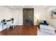 Cozy living room featuring a stone fireplace, hardwood floors, and comfortable seating at 777 Lake Frances Dr, Charleston, SC 29412