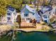Aerial view of a waterfront property with a spacious wooden deck, perfect for enjoying outdoor living and stunning views at 777 Lake Frances Dr, Charleston, SC 29412