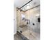Walk-in shower featuring glass enclosure, bench seating, and neutral tile at 777 Lake Frances Dr, Charleston, SC 29412