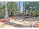 Backyard featuring a landscaped stone path with mulch and a stone border at 8 Townpark Ln # B, Charleston, SC 29412