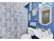 Full bathroom featuring blue painted walls, a vanity, and decorative mirrors at 8 Townpark Ln # B, Charleston, SC 29412