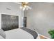 Bedroom featuring a ceiling fan, hardwood floors, and a spacious closet at 8 Townpark Ln # B, Charleston, SC 29412