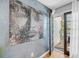 This bedroom's decor features an art-filled wall and backyard access via glass paneled doors at 8 Townpark Ln # B, Charleston, SC 29412