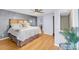 Bright main bedroom features hardwood floors and access to private bath and closet at 8 Townpark Ln # B, Charleston, SC 29412