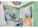 Eclectic dining room features geometric painted walls and access to the backyard and main living area at 8 Townpark Ln # B, Charleston, SC 29412