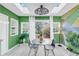 Bright dining room with geometric painted walls and backyard access through sliding glass doors at 8 Townpark Ln # B, Charleston, SC 29412