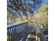 A private dock on a calm lake with a bench on the wooden deck for relaxing and taking in scenic views at 8 Townpark Ln # B, Charleston, SC 29412